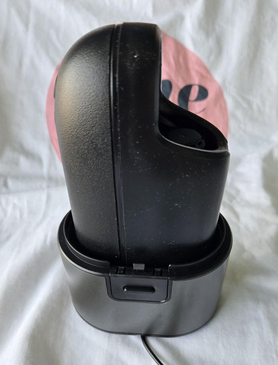 Arcwave Ion sitting upright inside its drying and charging base after a cleaning session