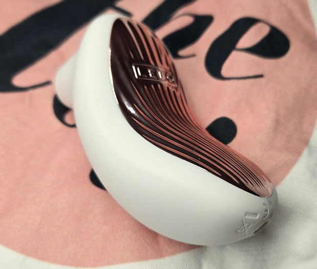 Back view of LELO Sona 3’s rippled shell and ergonomic curve that fits naturally in the palm during solo or bath play