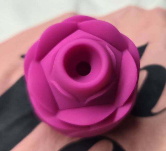 Close-up of the ROMP Rose’s wide, rounded suction nozzle photographed from above, showing how it covers the clitoral area.