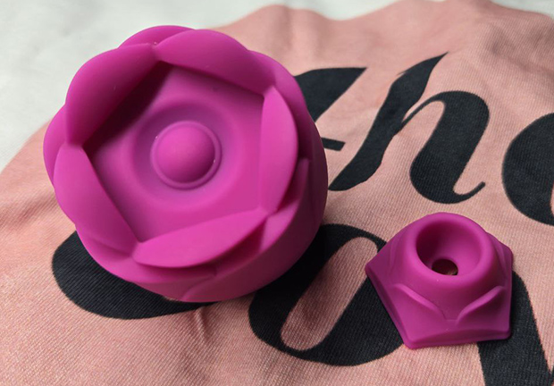 ROMP Rose disassembled with the silicone nozzle removed, showing the toy ready for cleaning and drying after use.