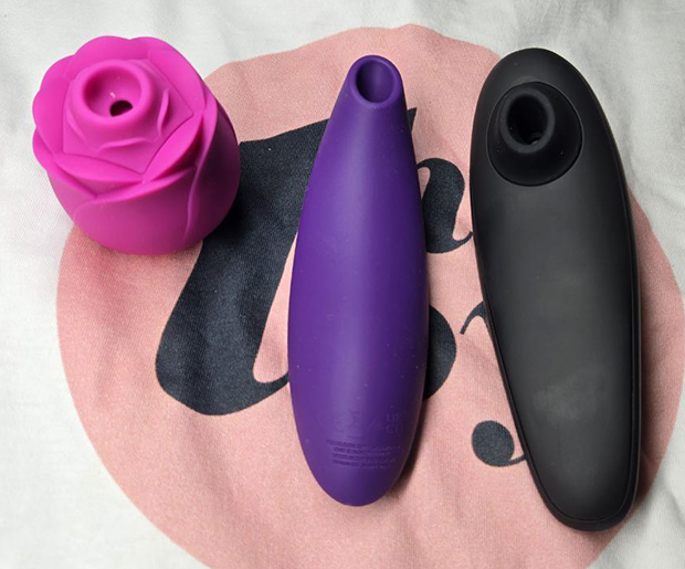 Side-by-side comparison of ROMP Rose (left), We-Vibe Melt 2 (center), and Womanizer Classic 2 (right), showing differences in nozzle design and body shape.