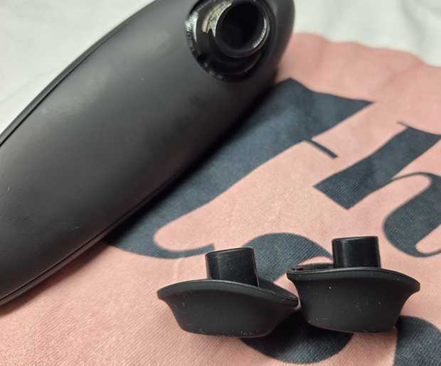 Close-up of the Womanizer Classic 2’s nozzle removed, showing both small and medium heads side-by-side. You can easily remove them to clean the toy.