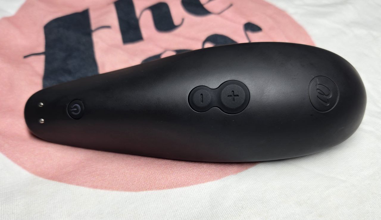 Horizontal close-up of the Classic 2’s button side, showing ergonomic curve and real-user wear, captured during repeated sessions to show durability and grip ease.