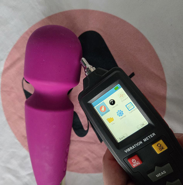 LELO Smart Wand 2 next to a vibrometer.