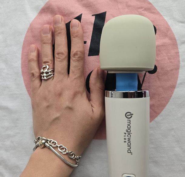 Magic Wand Plus compared to a small female hand.