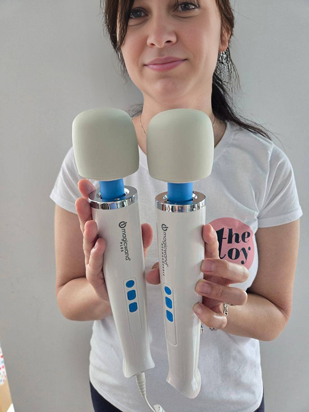 Amie demonstrates Magic Wand Plus in one hand and Magic Wand Rechargeable in the other.