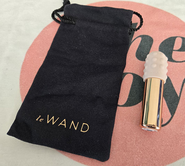 Le Wand Bullet next to its black stylish poach