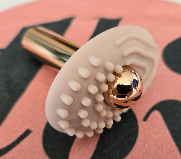 Le Wand Bullet and its broad massage attachment.