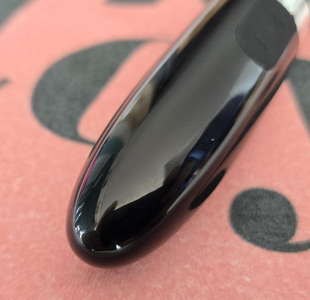 Extreme close-up of the LELO Mia 2's smooth, rounded dome tip showing the seamless hard plastic surface that delivers focused surface stimulation