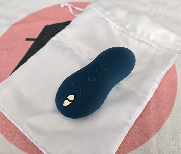 We-Vibe Touch X over its white satin pouch
