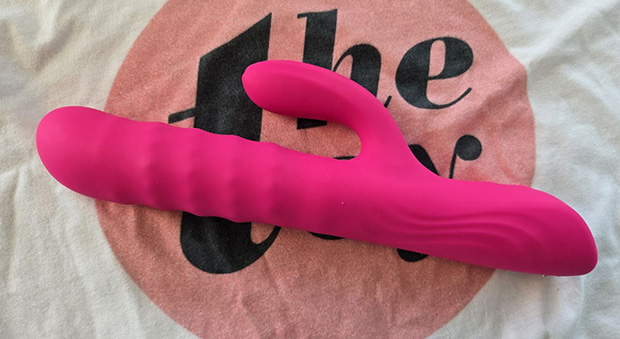 Photo of the Lovense Velvo rabbit vibrator showing the rolling bead shaft, rotating tip, flexible clit arm, control buttons, and charging point.