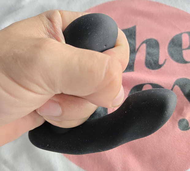 Lovense Edge 2 demonstrated in a hold by a male hand