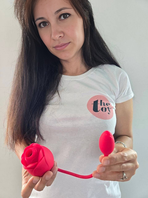 Amie Dawson PhD demonstrating Lovehoney Rose Glow, rose bosy in one hand and the G-spot egg in the other