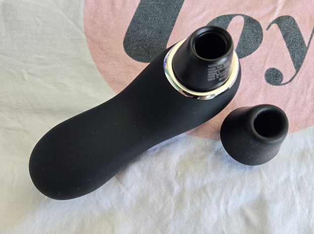 Close-up of the Lovehoney Thrill's detached silicone nozzle showing the oval mouth opening, the interior chamber, and the firm rim edge.