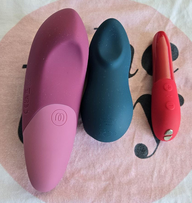 Side-by-side comparison of the Womanizer Vibe, We-Vibe Touch X, and We-Vibe Tango X showing relative size differences—the Vibe is noticeably larger than both competitors.