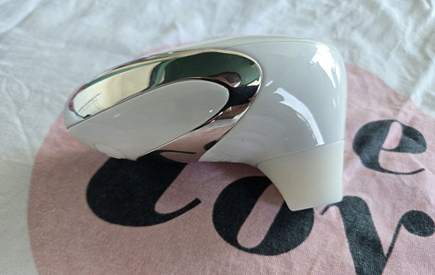 Womanizer W500 from side, demonstrating the 2.36-inch body width and palm grip position