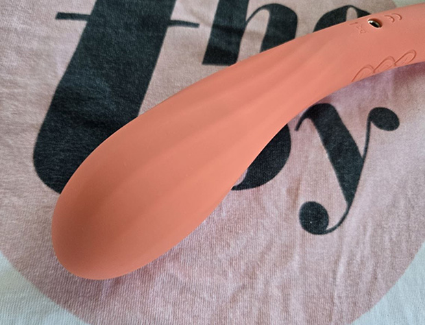 Close-up detail of the LELO Boomerang's silicone insertable tip showing subtle twisted ridges along the surface that provide textured stimulation.