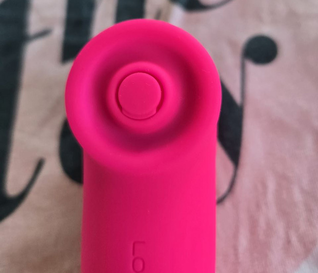 Close-up of the Lovense Fizz tapping end showing the small 5.5mm percussive membrane surrounded by the toy's silicone body